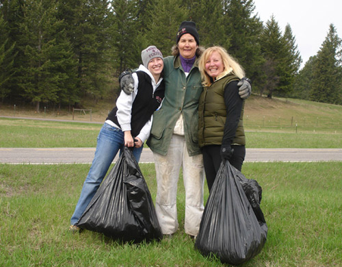 Dani, Andrea and Angela picking up trash along Highway 35