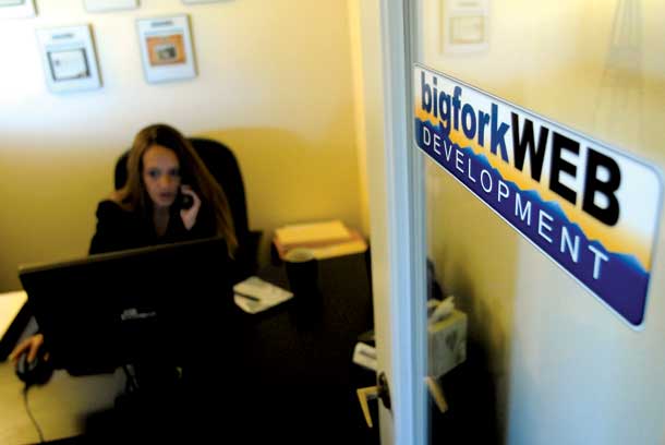 Jana Primmer works in her office at BigforkWEB Development. Primmer is the project manager for the growing Bigfork company. - Lido Vizzutti/Flathead Beacon